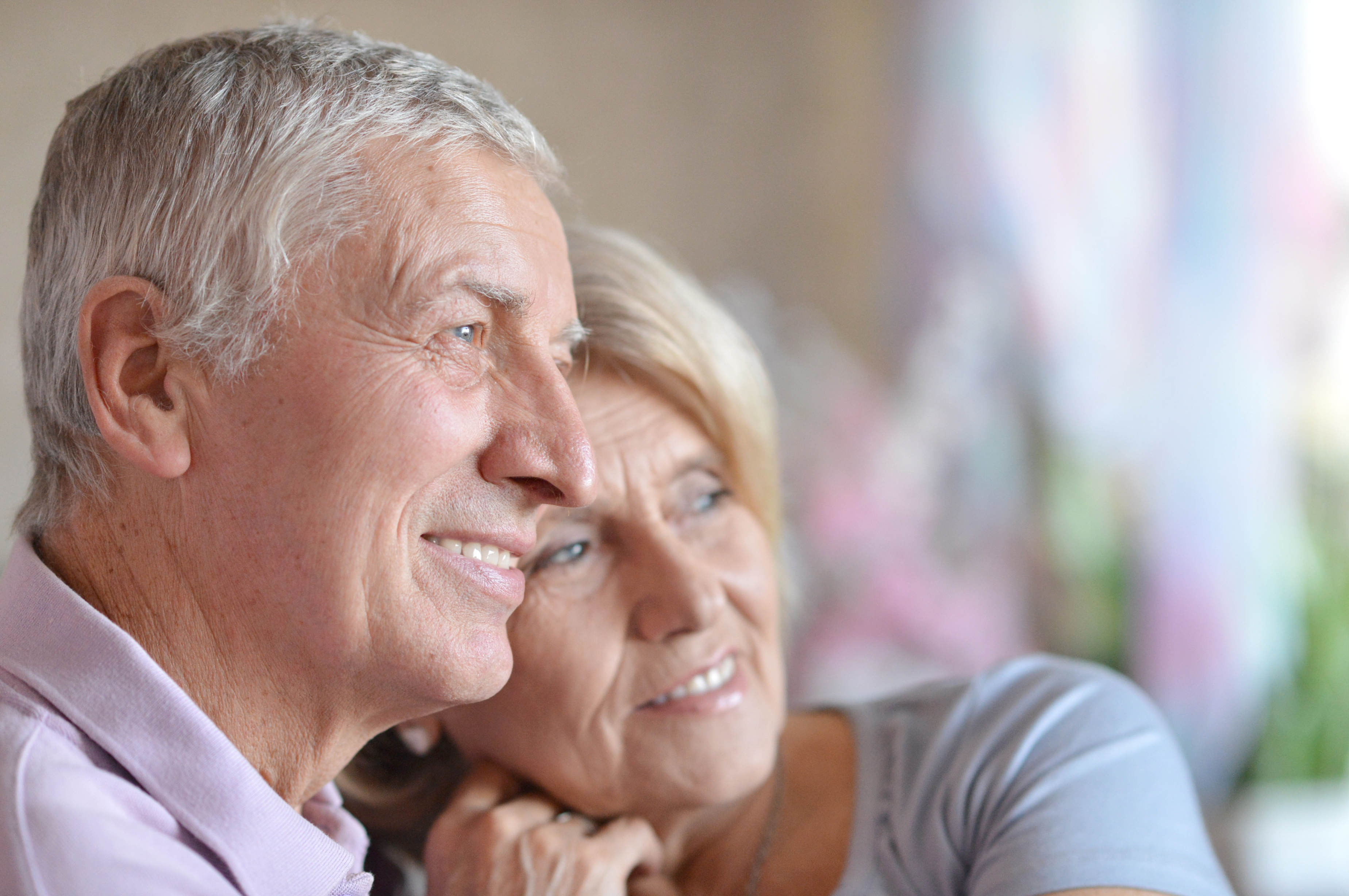 smiling elderly couple