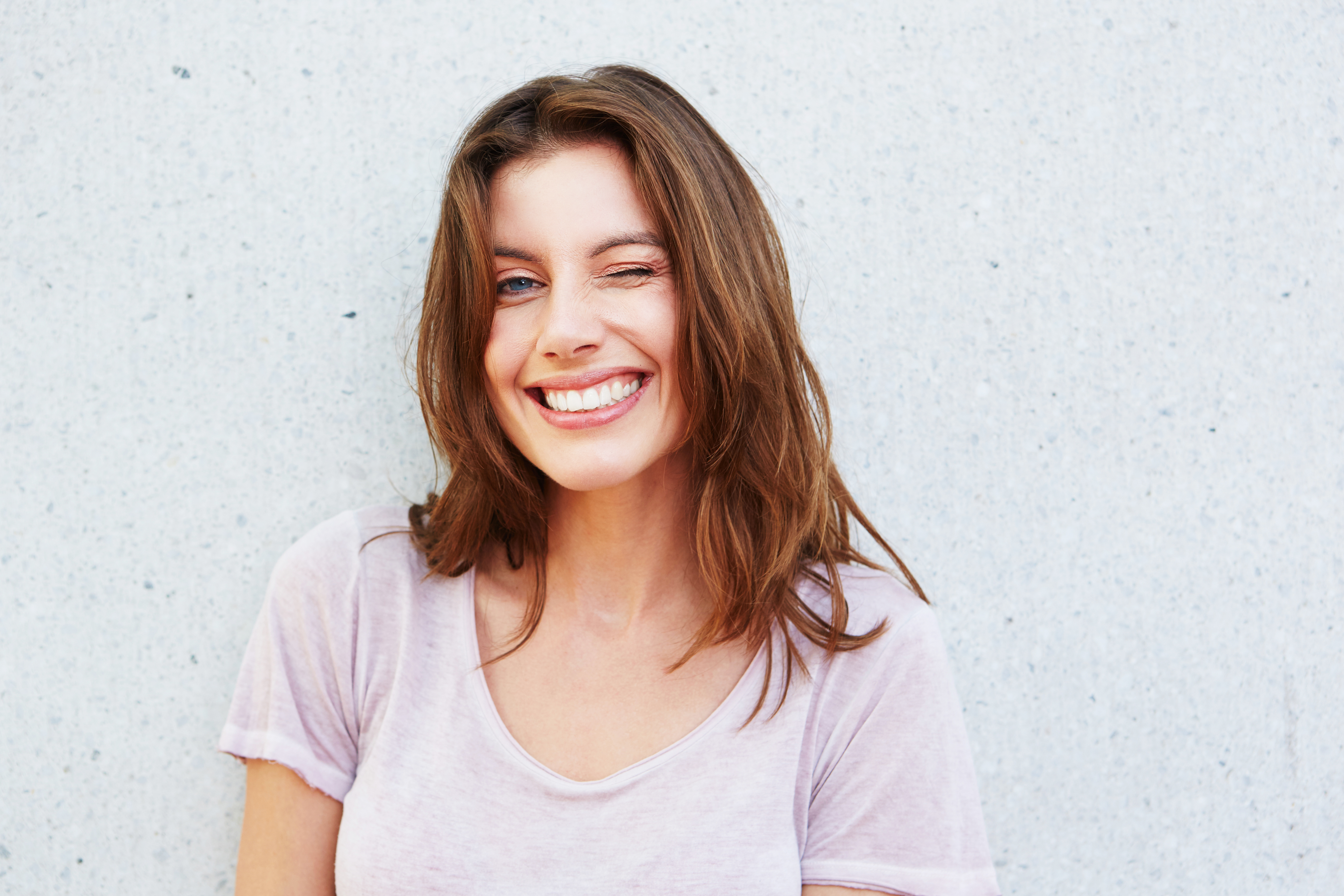 Smiling woman winking