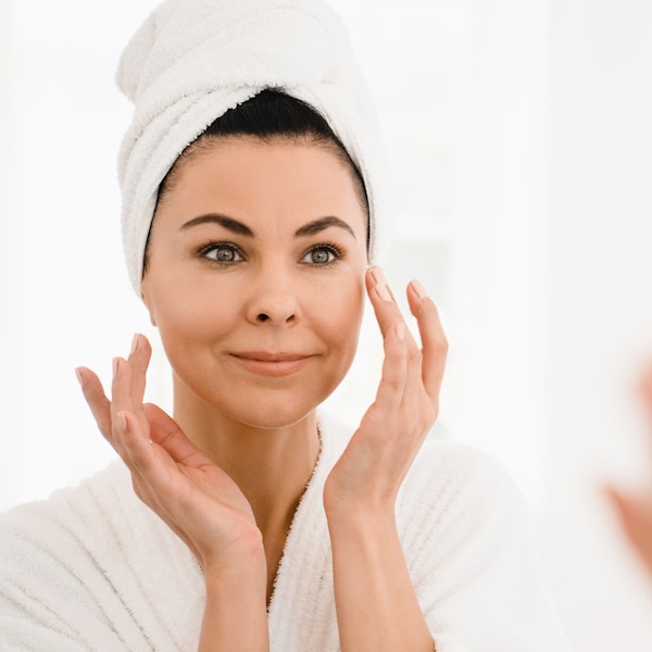Mature woman doing skincare