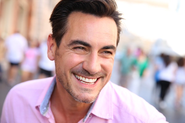 Smiling man with dental veneers