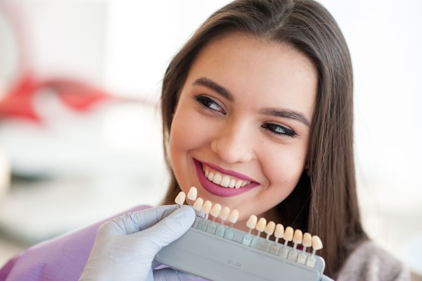 woman looking at veneers