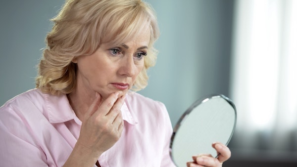 Woman looking in mirror