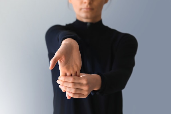 Woman doing wrist exercises