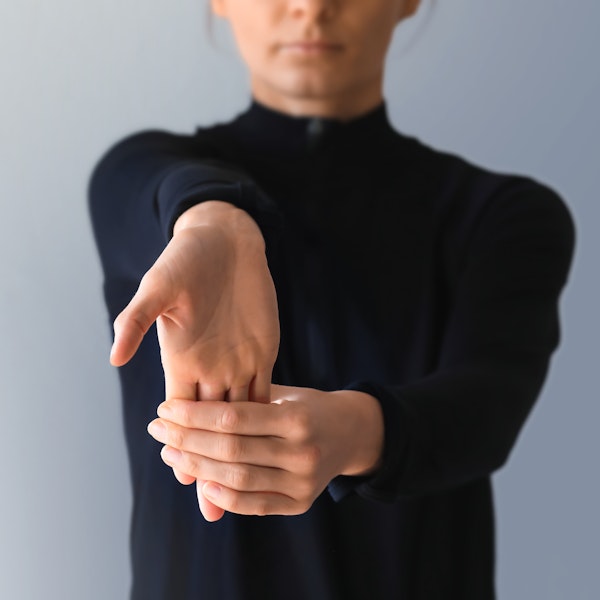 Woman doing wrist exercises