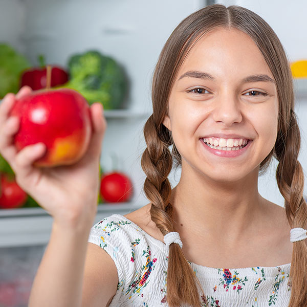 Girl holding apple