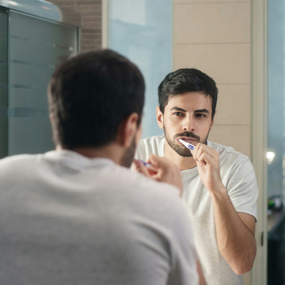 Man brushing teeth