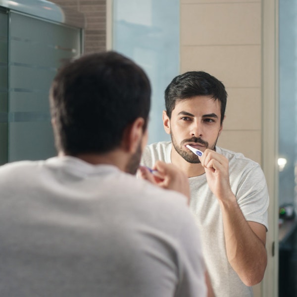 Man brushing teeth