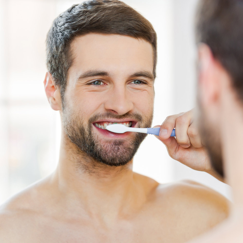 Man brushing teeth