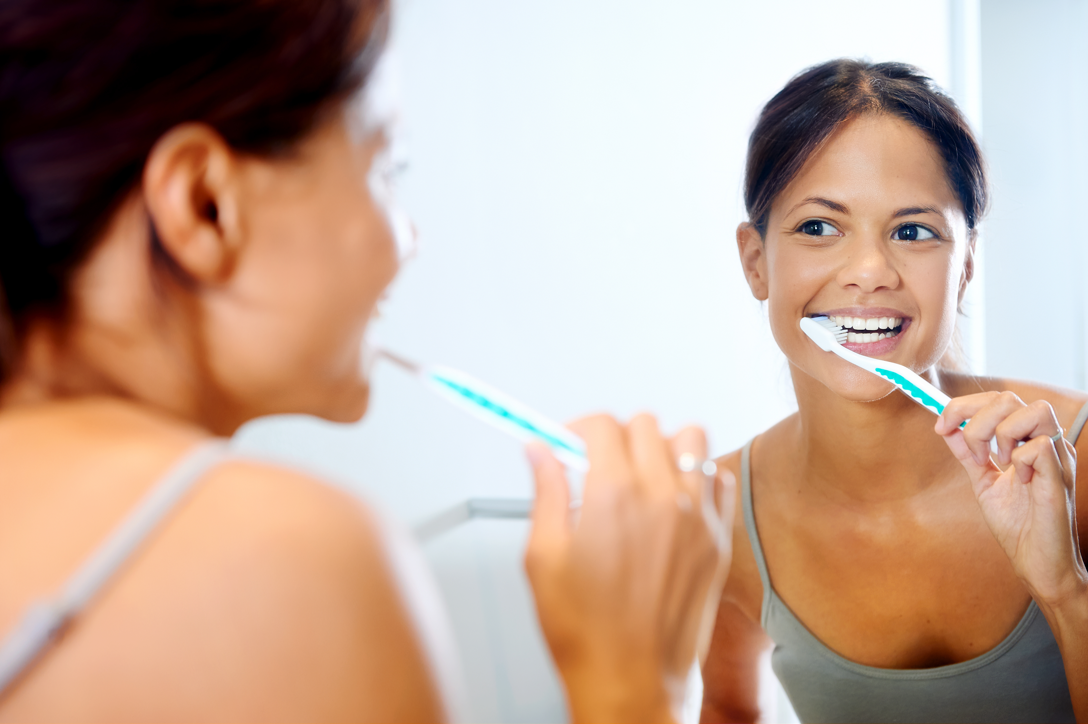 Young girl brushing her teeth