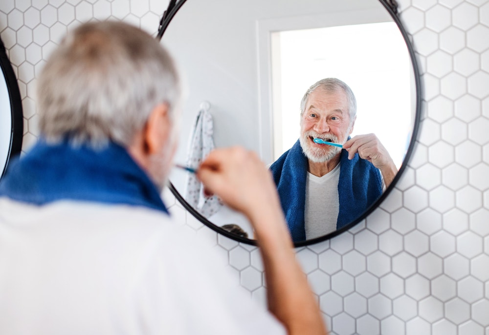 man brushing teeth