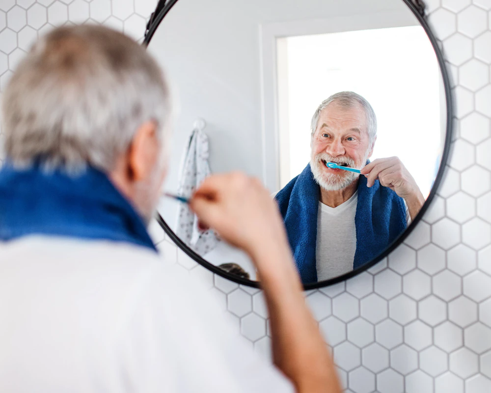 man brushing teeth