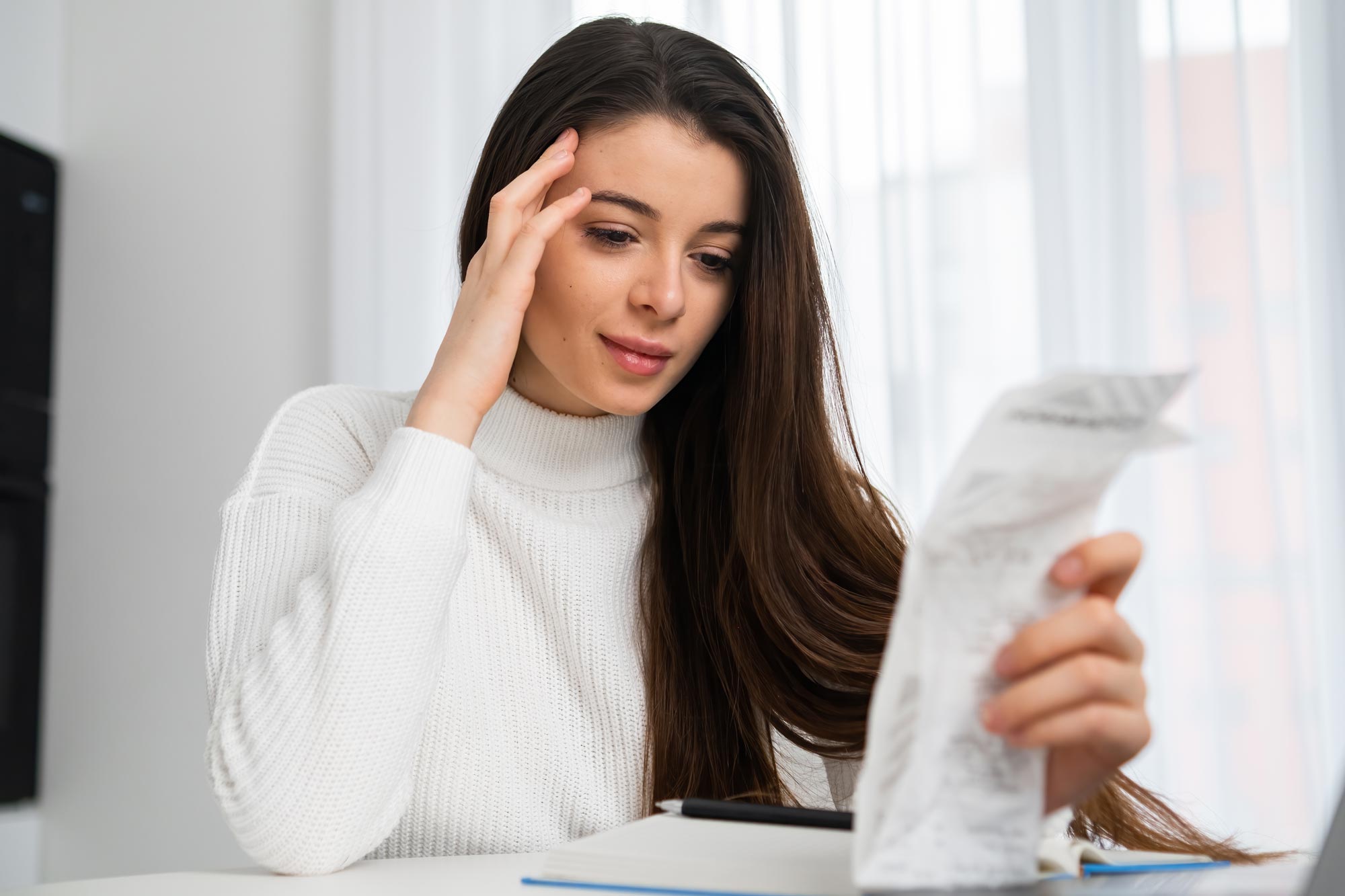 Woman looking at bills