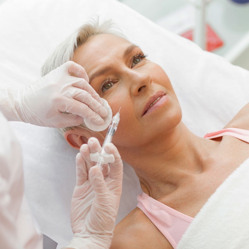 Mature woman getting BOTOX in face