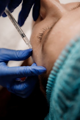 woman receiving facial injection