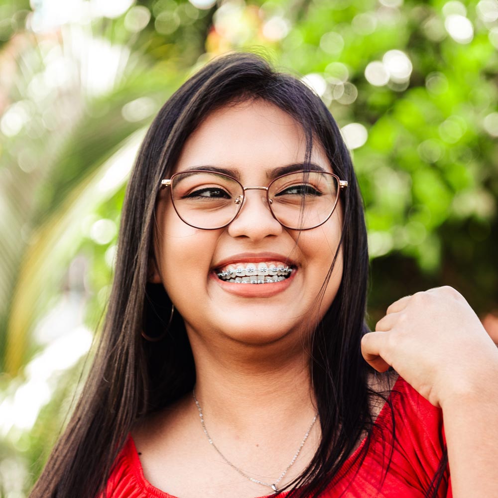 Teenager laughing with metal braces