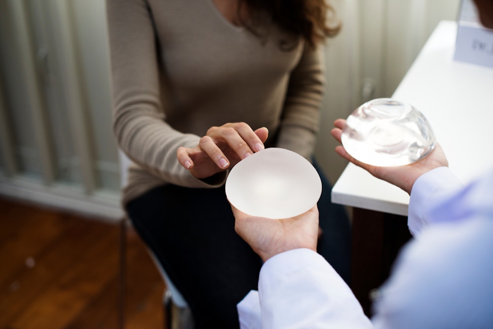 Woman examining implants