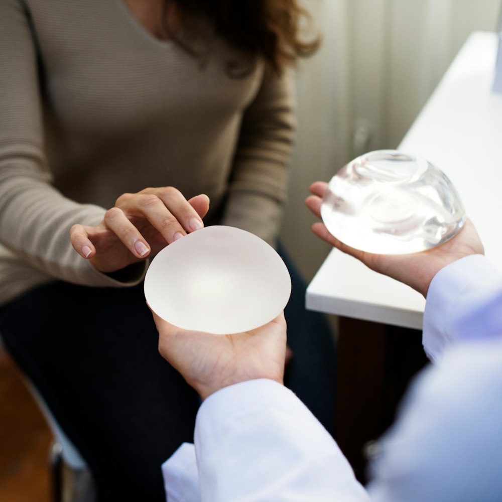 woman choosing breast implant types