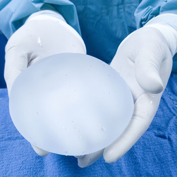 Breast implant in someone's hand