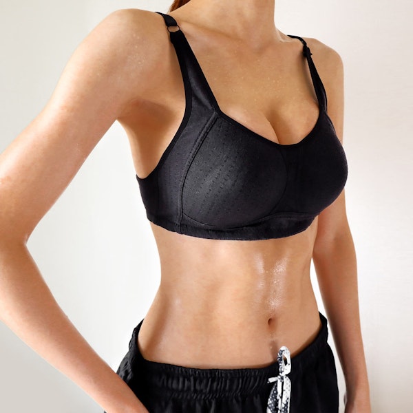 Woman in black sports bra and sweats