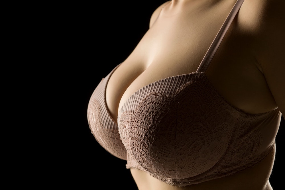 Breast in gray lacy bra