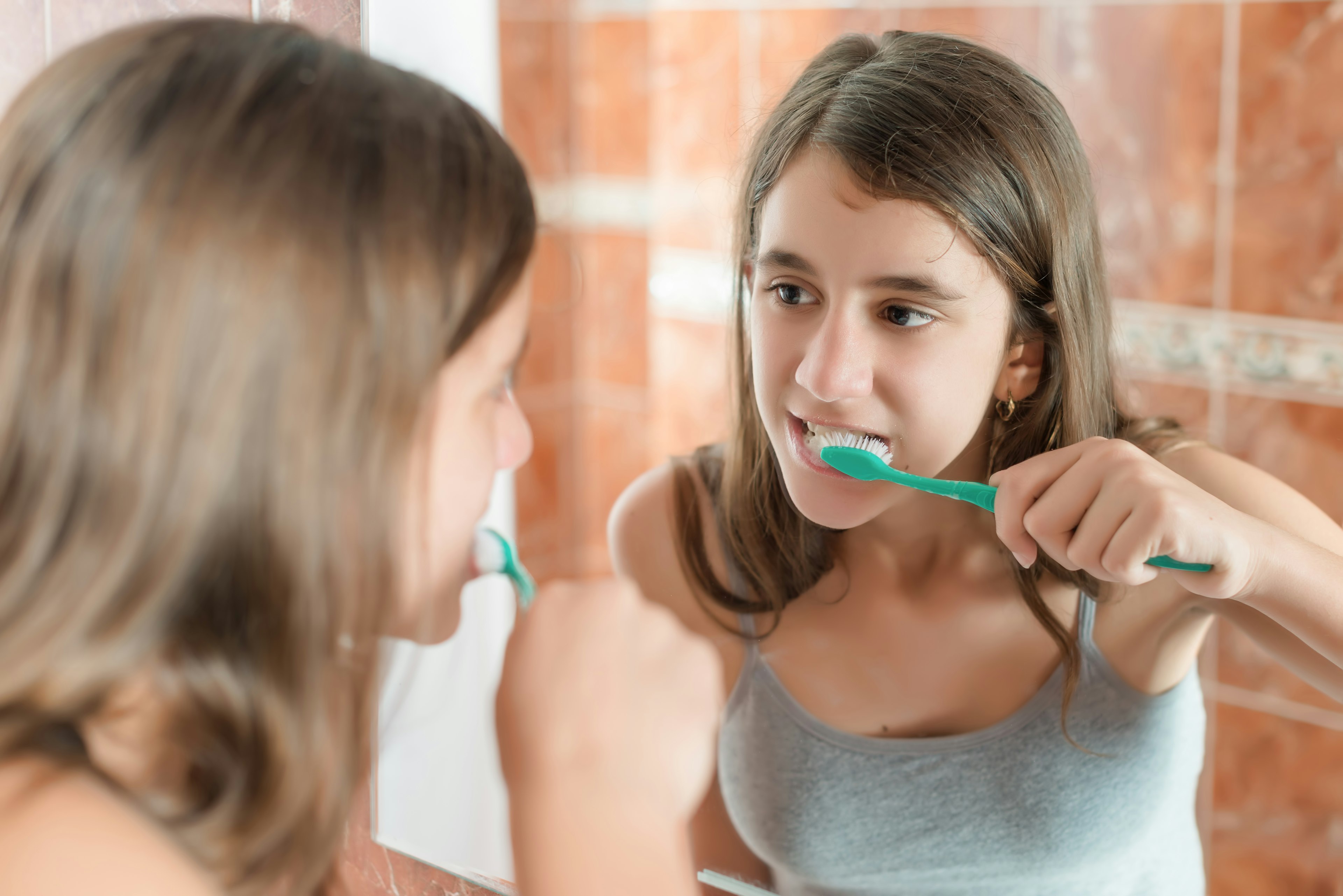 woman brushing teeth