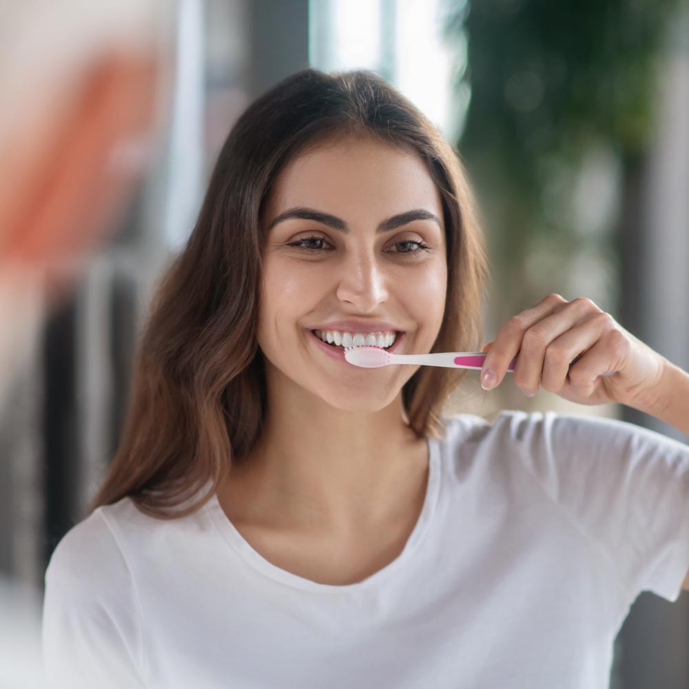 Woman brushing her teeth