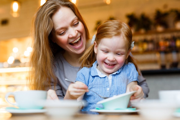 Mother and child eating at a cafe