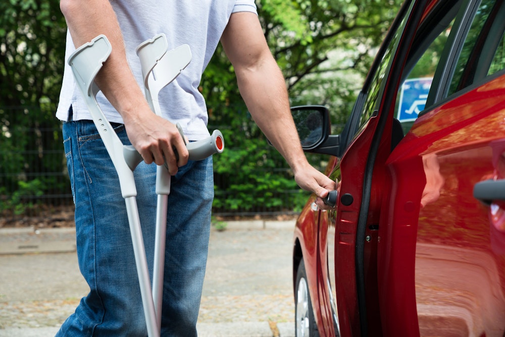 Injured person walking to car
