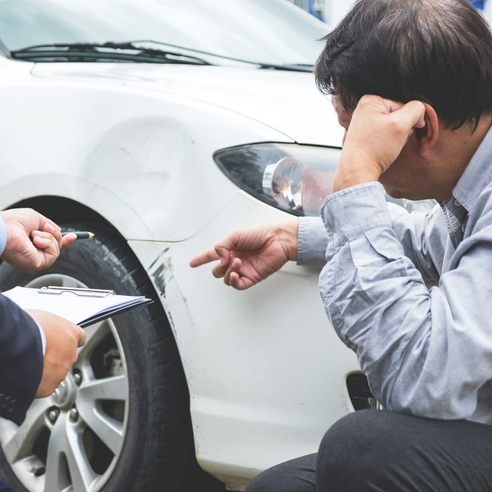 driver examining car