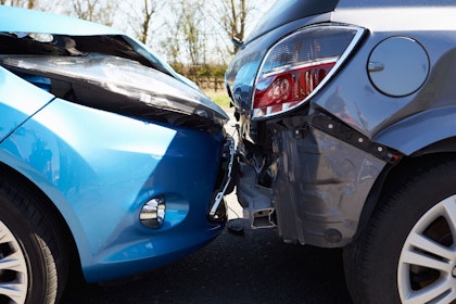 Close-up of two cars damaged in a fender bender