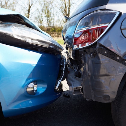 Close-up of two cars damaged in a fender bender