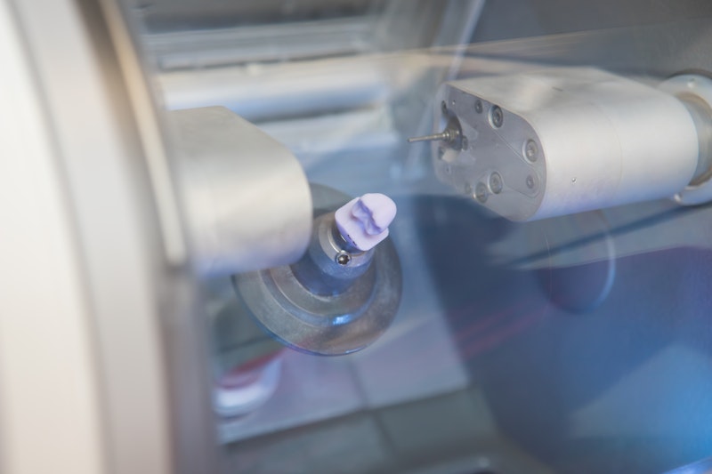 dental crown being made with CAD/CAM tech