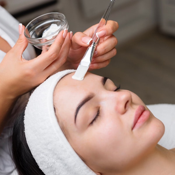 woman getting a post-peel restorative mask