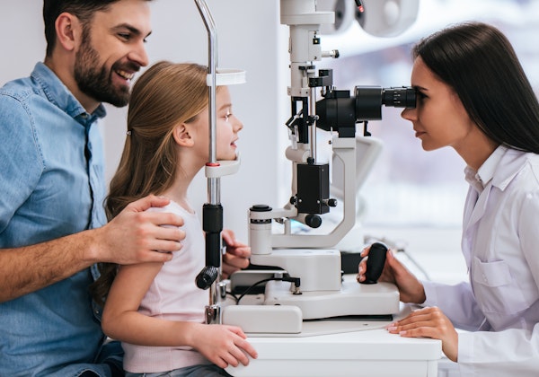 Dad taking daughter to eye appointment