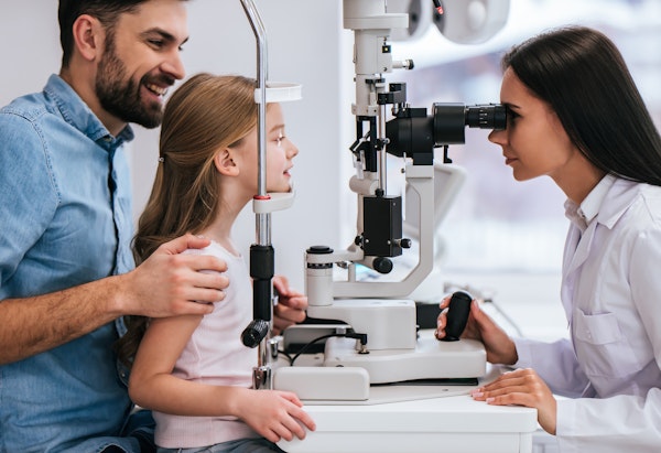 Dad taking daughter to eye appointment
