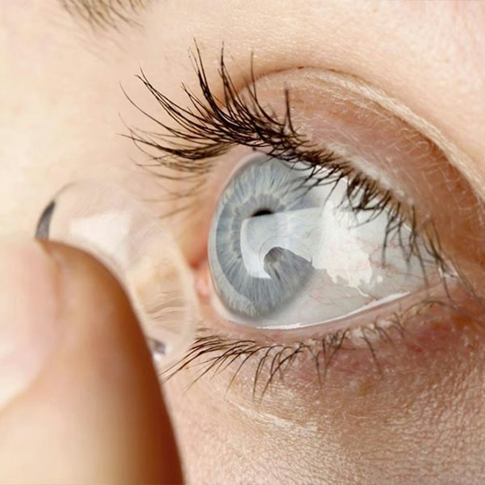 Contact lens being put into eye