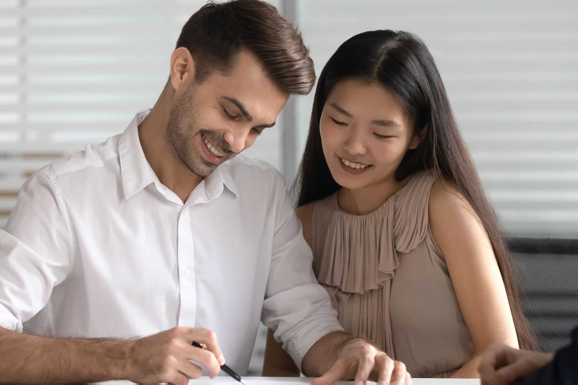 Couple looking over paperwork for surrogacy