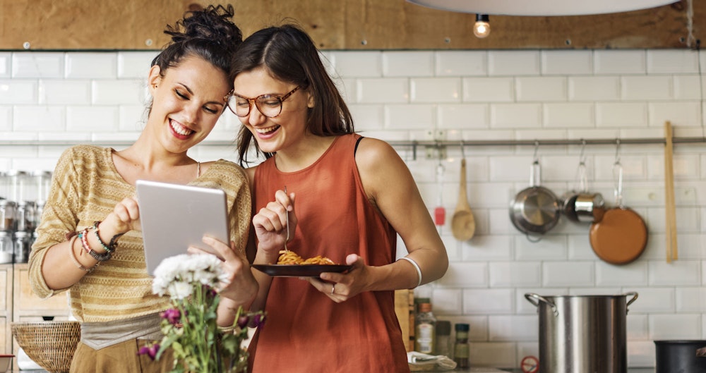 two women eating a healthy meal together