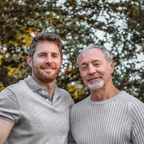 Father and son smiling together