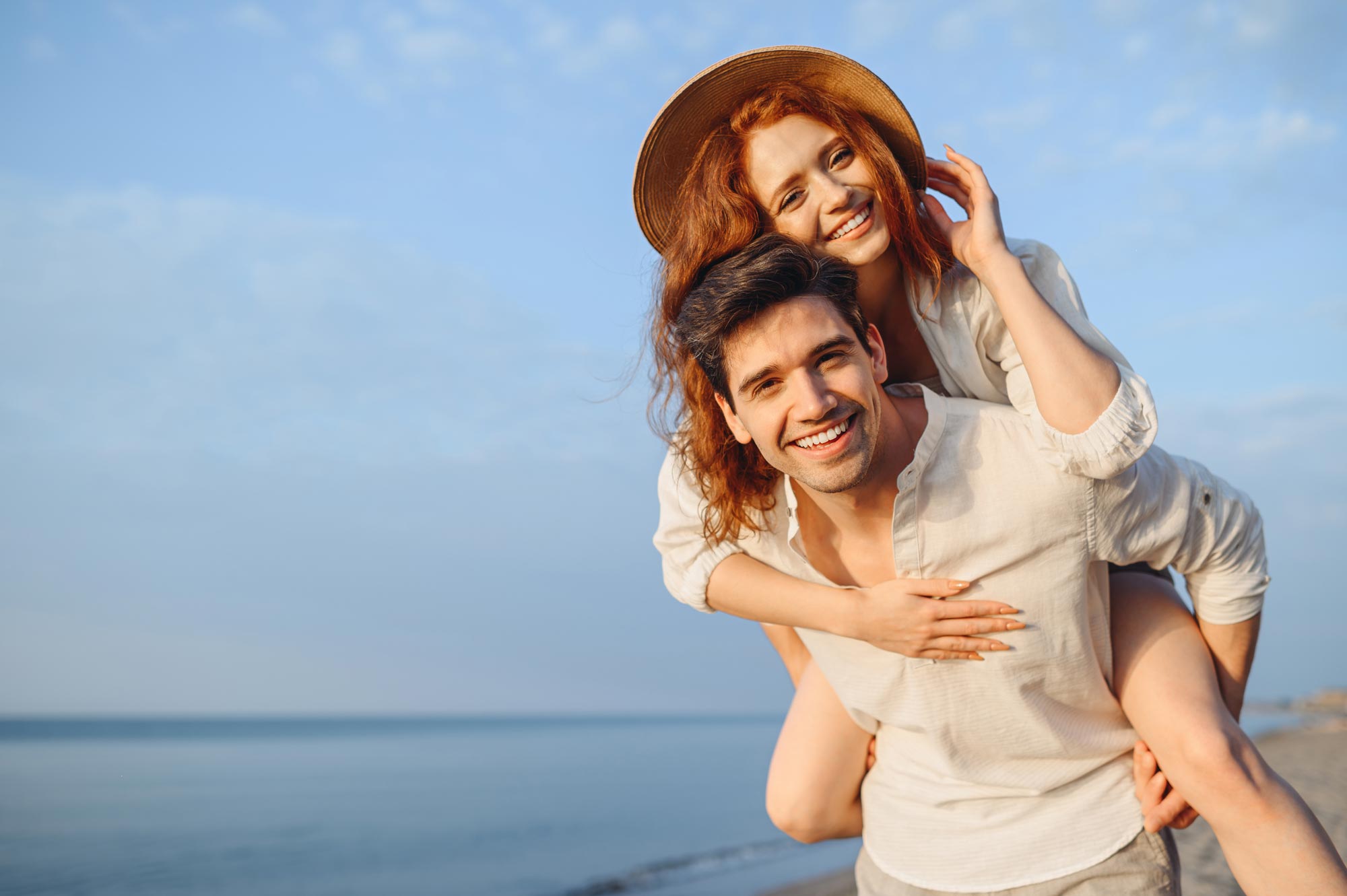 Smiling young couple with thick, full hair