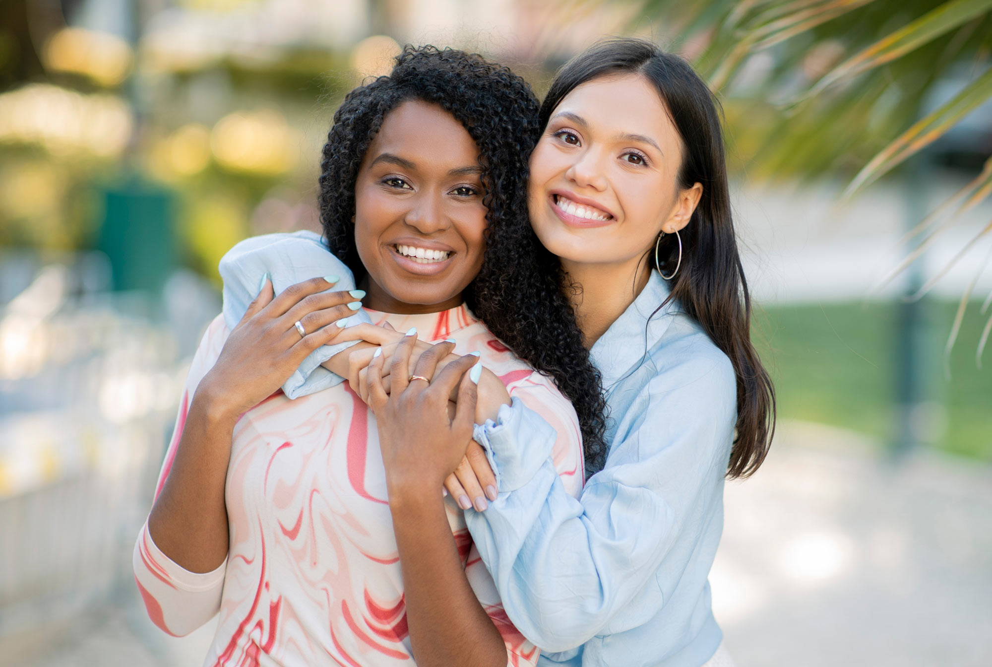 Smiling couple hugging each other with teeth whitening