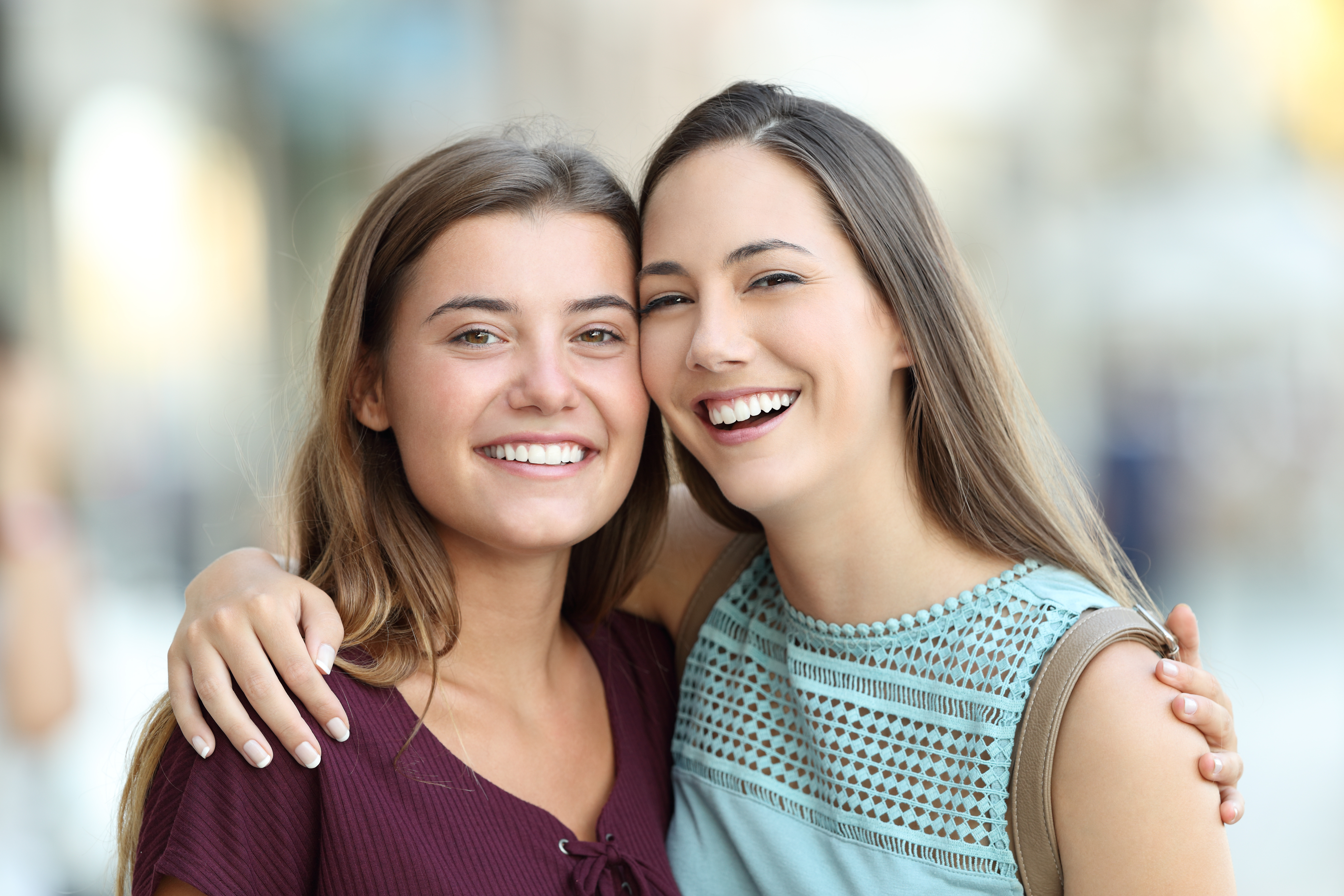 Two women smiling brightly