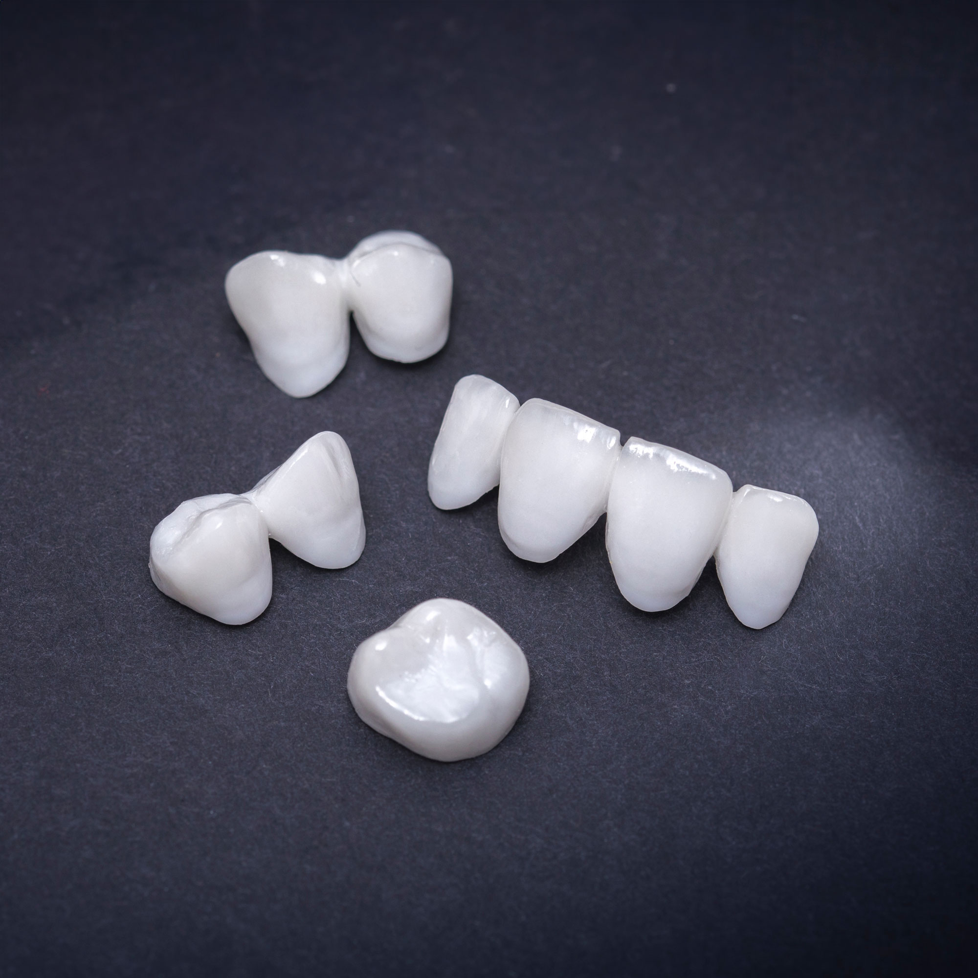 Dental crown and bridges against a dark background