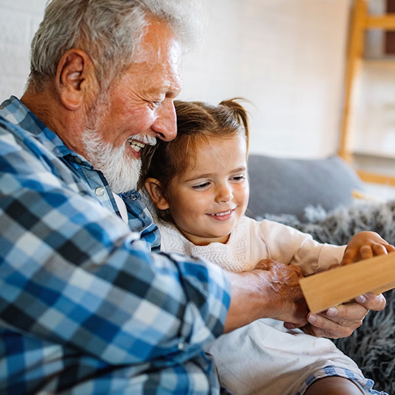 Man holding granddaughter