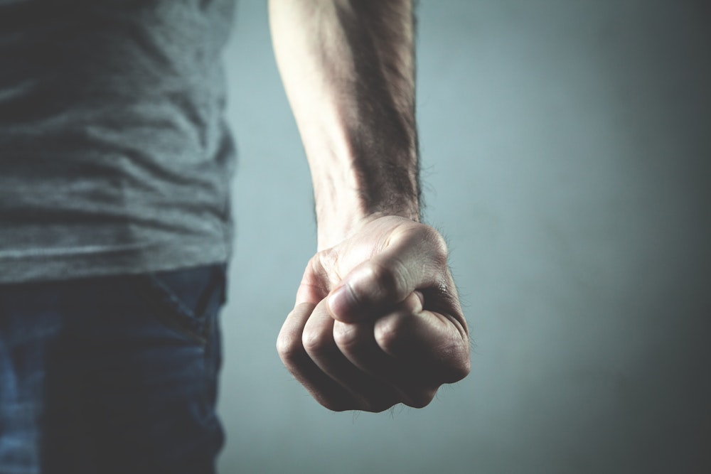 Man's fist balled up in anger