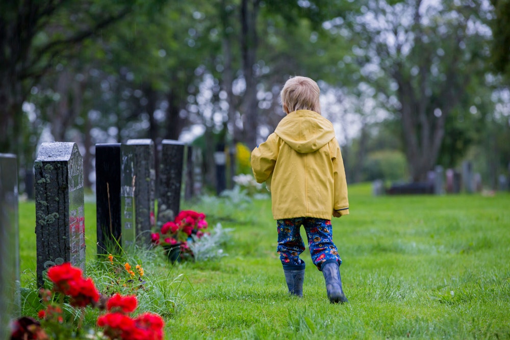 Child at cemetery