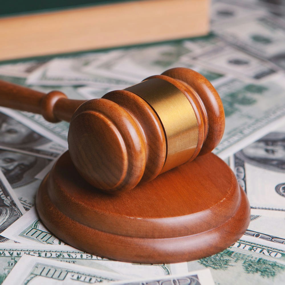 Gavel on top of dollar bills