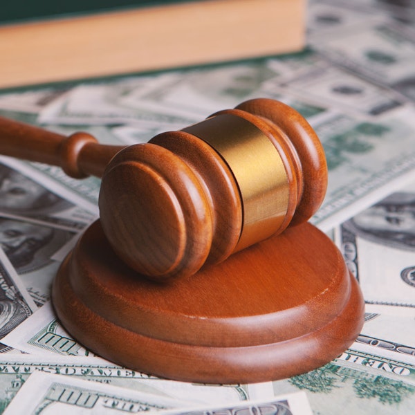 gavel stacked on top of money