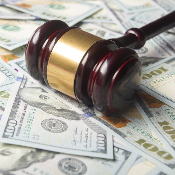 Gavel on top of money