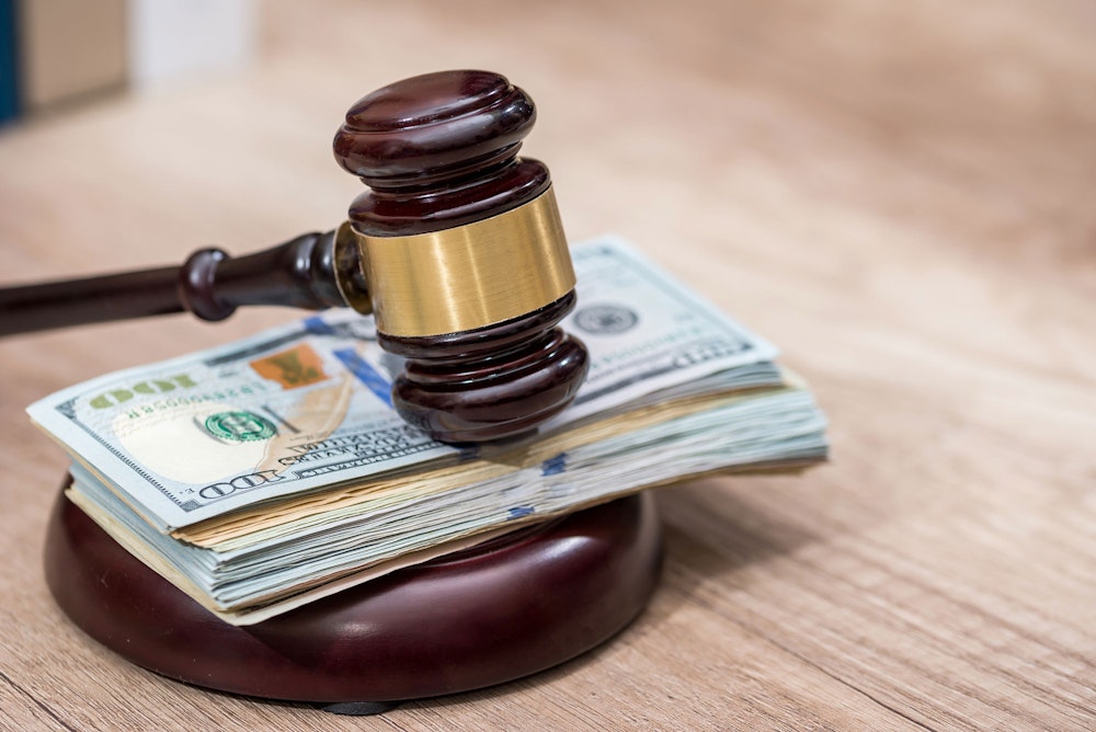 Gavel on top of money